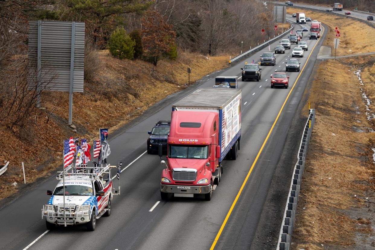 Bob Bolus, a businessman from the Scranton, Pa., area, drives his semitruck leading a 