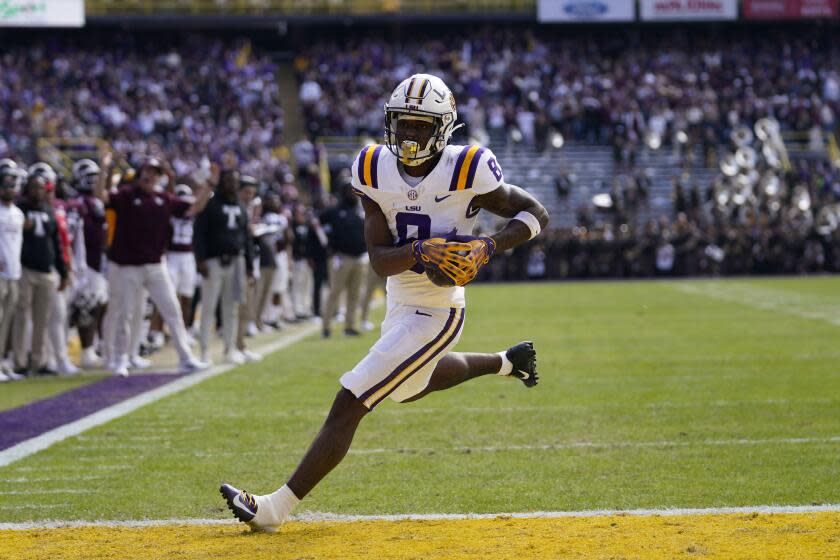 LSU receiver Malik Nabers (8) runs for a touchdown after a pass reception against Texas A&M.