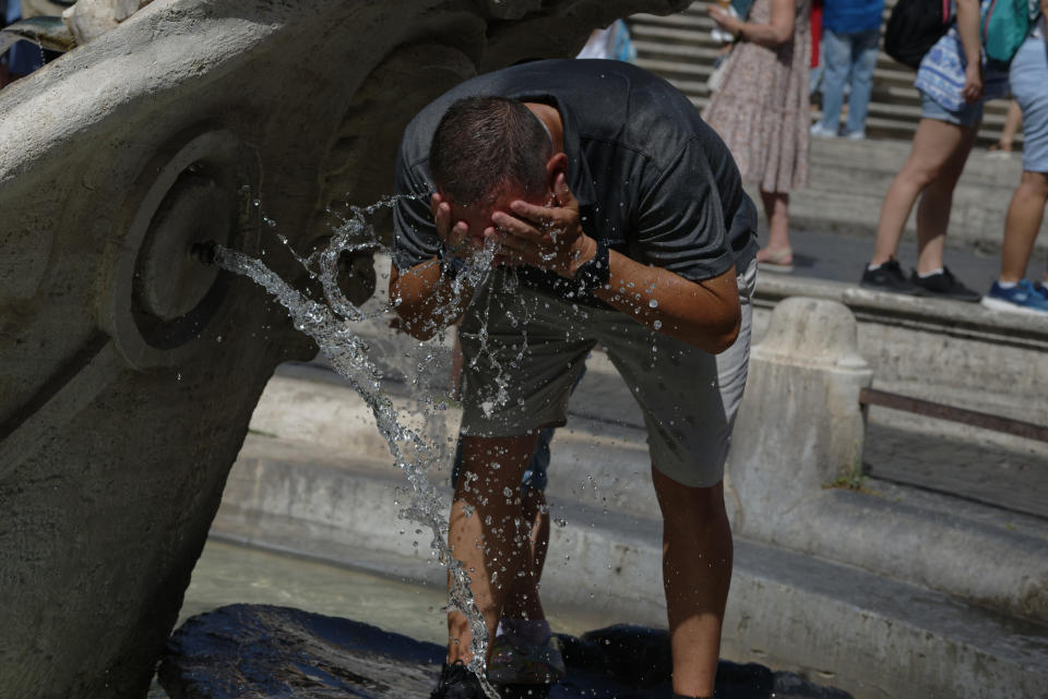 People cool off during an ongoing heat wave with temperatures reaching 40 degrees, at Piazza di Spagna, on July 16, 2023 in Rome, Italy.  (Photo by Massimo Valicchia/NurPhoto via Getty Images)