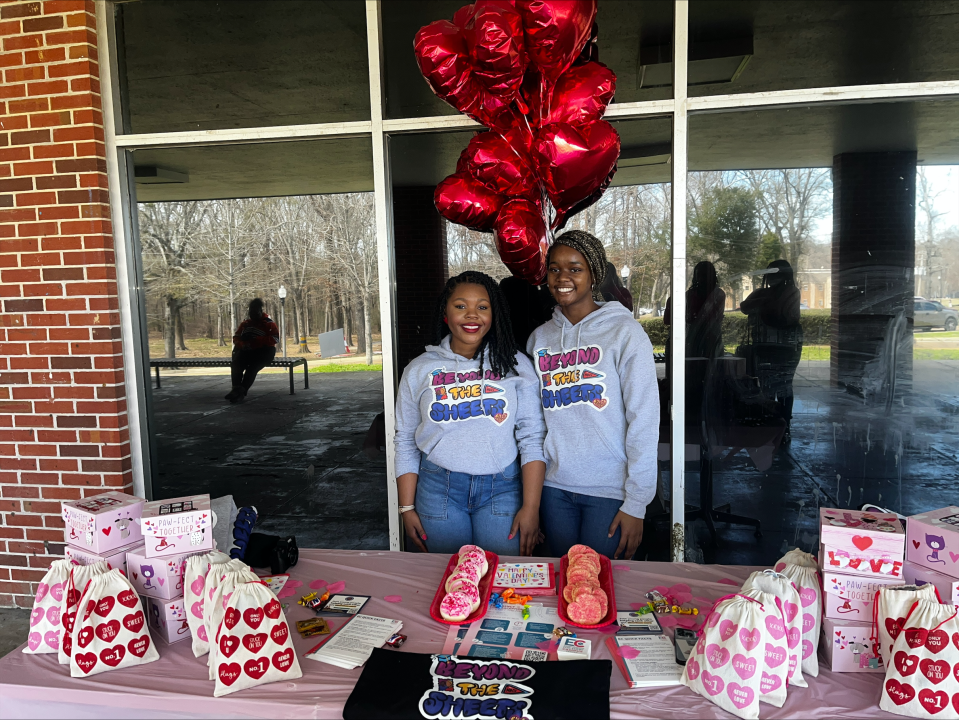 Nayla McClue and Rokiyah Hobbs run a Valentine's Day event as Beyond the Sheets ambassadors on the Tougaloo College campus.