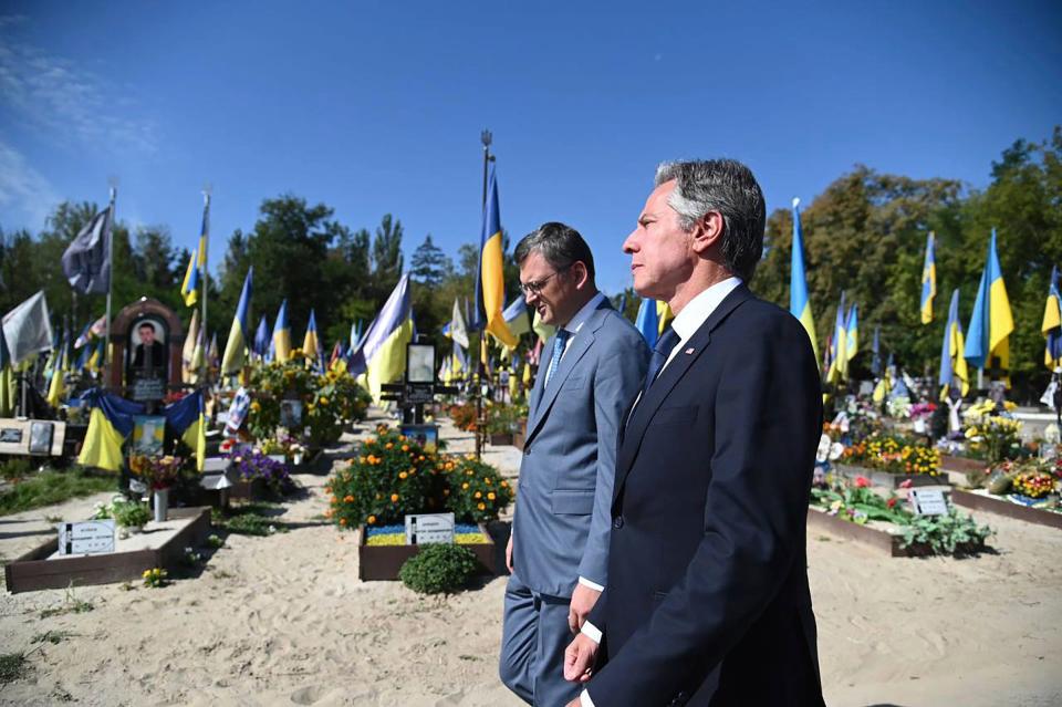 In this photo provided by Ukrainian Ministry of Foreign Affairs, Secretary of State Antony Blinken, right, and Ukrainian Foreign Minister Dmytro Kuleba walk at the Alley of Heroes at the Berkovetske cemetery in Kyiv on Sept. 6, 2023.
