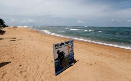 An empty beach is seen near Pearl Divers, a diving school, at Unawatuna beach in Galle