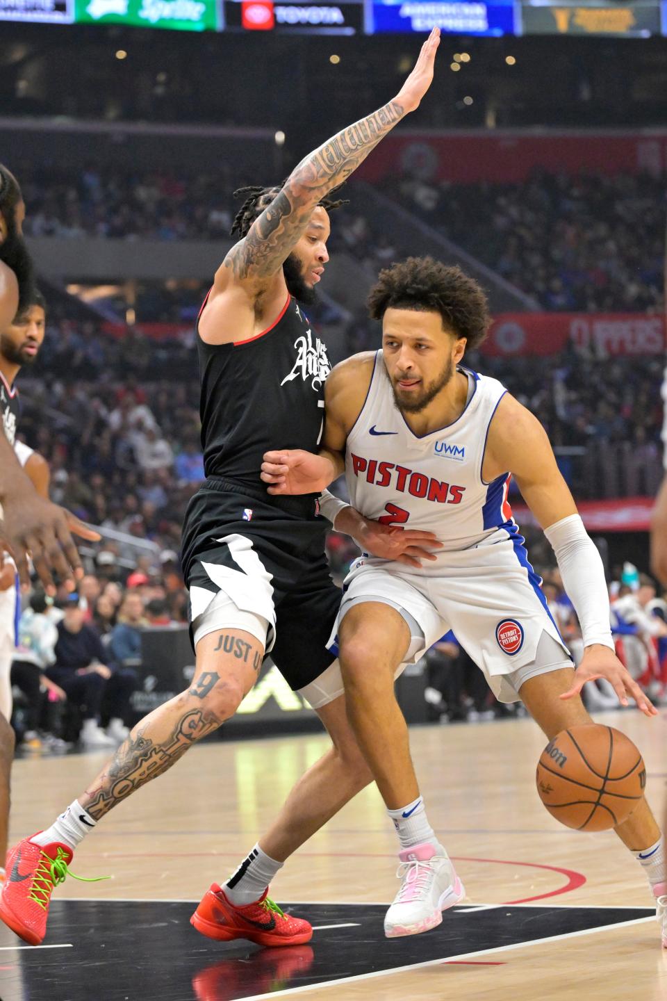 Detroit Pistons guard Cade Cunningham (2) is defended by Los Angeles Clippers guard Amir Coffey (7) in the first half at Crypto.com Arena in Los Angeles on Saturday, Feb. 10, 2024.