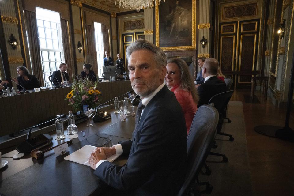 Prime Minister Dick Schoof turns to the photographers during a cabinet meeting of the new government in The Hague, Netherlands, Tuesday, July 2, 2024. The Netherlands has a different prime minister for the first time in 14 years as Dutch King Willem-Alexander swore in the country’s new government Tuesday, more than seven months after elections dominated by a far-right, anti-Islam party. (AP Photo/Peter Dejong)