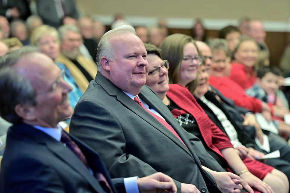 Kirk C. Downey sits with his family during his Feb. 16, 2024, investiture ceremony as associate judge for the Washington County Circuit Court.