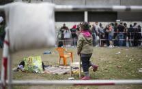 Migrants wait in front of the State Office for Health and Social Affairs (LaGeSo), in Berlin, Germany, September 3, 2015. REUTERS/Hannibal Hanschke