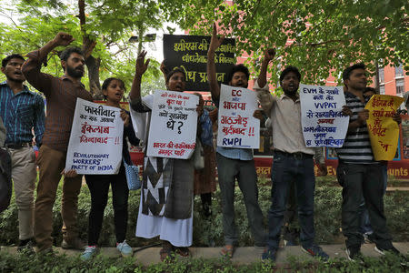 People shout slogans as they display placards during a protest to demand Electronic Voting Machines (EVM) numbers be tallied with Voter-Verified Paper Audit trail (VVPAT) machines numbers, outside the office of the Election Commission of India in New Delhi, India, May 22, 2019. REUTERS/Anushree Fadnavis