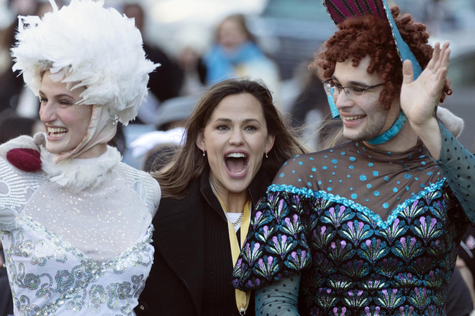 Members of Harvard University's Hasty Pudding Theatricals honor Jennifer Garner as "Woman of the Year" during a parade, Saturday, Feb. 5, 2022, in Cambridge, Mass. (AP Photo/Michael Dwyer)