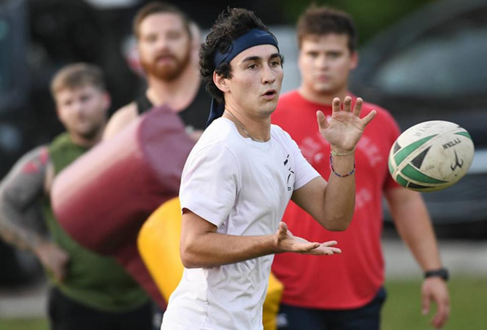 Michael Holdridge, a UCSB student, tracks a lateral toss from a teammate during a passing drill at Chaplain Community Park. Locals are working to organize a rebirth of rugby in Beaufort County by bringing back a storied squad that disbanded in 2017.