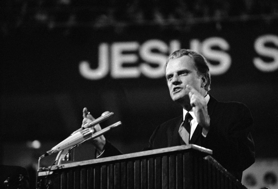 <p>Billy Graham preaches a sermon in Dortmund’s Westfalen-Halle on April 5, 1970, at the start of an eight-day crusade broadcast throughout Europe via closed television circuit, in 35 cities and 10 countries. (Photo: Hinniger/AP) </p>