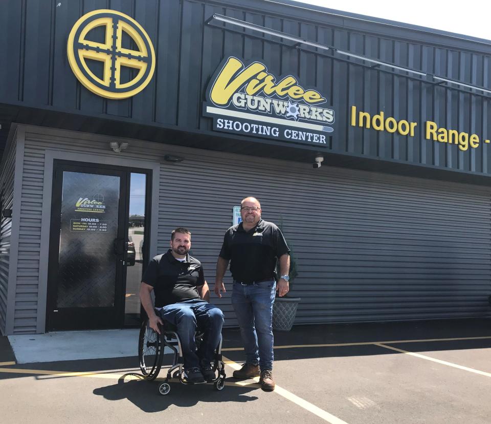 Scott Virlee, left, owner and gunsmith of Virlee Gunworks Shooting Center, is joined by business partner Steve Estes outside the new Sturgeon Bay store, Virlee's second location in Northeast Wisconsin, the day before its July 31 grand opening.