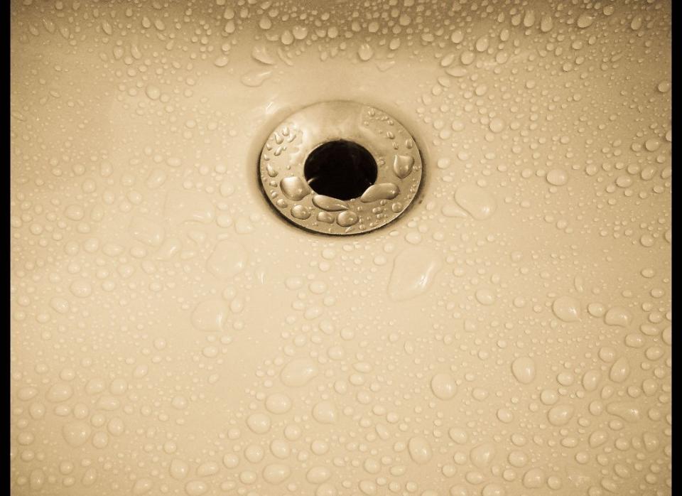 If your sink or bathtub drain is clogged, it may take a long time for water to go down. A really effective way to solve this problem is by snaking it. Also known as a drain auger, this long metal rope has a spiral end that will catch all the washed away hair and product buildup! First, unscrew the screen from the tub drain and use the bent wire to fish out any debris. For more information, read how it worked for one of our editors.     For a full tutorial head over to <a href="http://www.thisoldhouse.com/toh/article/0,,193799-4,00.html" target="_hplink">This Old House</a>. 