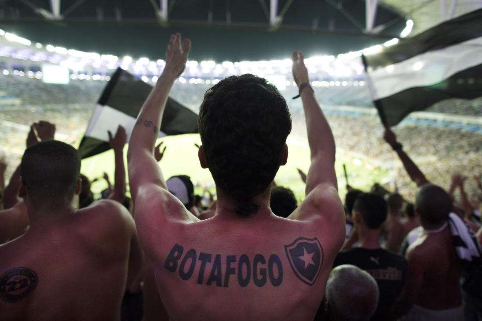 FILE - Fans of the Botafogo soccer team react during the Copa Libertadores match at Maracana stadium in Rio de Janeiro, Brazil, April 2, 2014. Brazil’s Senate has created a commission to investigate soccer match-fixing. The move comes amid allegations from the top shareholder of a team that dominated the national league throughout most of last year but failed to clinch the championship. (AP Photo/Leo Correa, File)