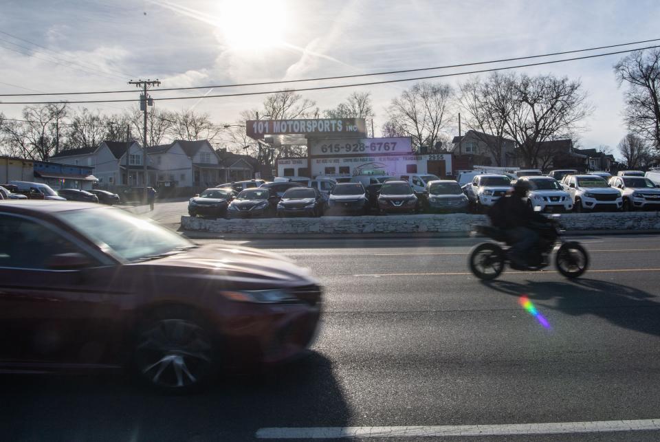 A motorcyclist drives along traffic at Nolensville Pike goes in the opposite direction in Nashville, Tenn., Wednesday, Feb. 7, 2024.