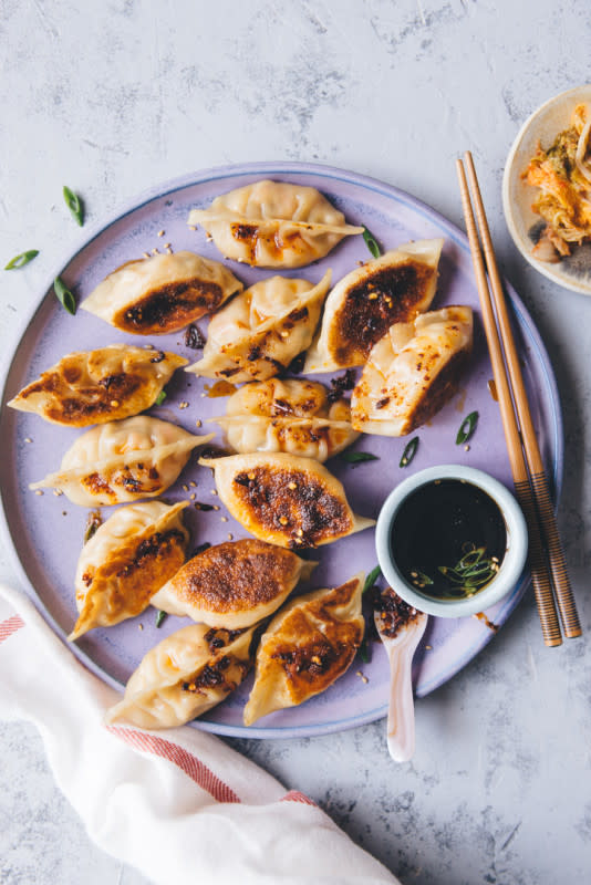 <p>Healthy Nibbles and Bits</p><p>These tofu and kimchi dumplings are perfect for parties. The filling includes tofu, kimchi, carrots, shallots and spices. Pan-fry these dumplings for extra crispy bottoms!</p><p><strong>Get the recipe: <a href="https://healthynibblesandbits.com/tofu-and-kimchi-dumplings/" rel="nofollow noopener" target="_blank" data-ylk="slk:Tofu and Kimchi Dumplings;elm:context_link;itc:0;sec:content-canvas" class="link "><em>Tofu and Kimchi Dumplings</em></a></strong></p>