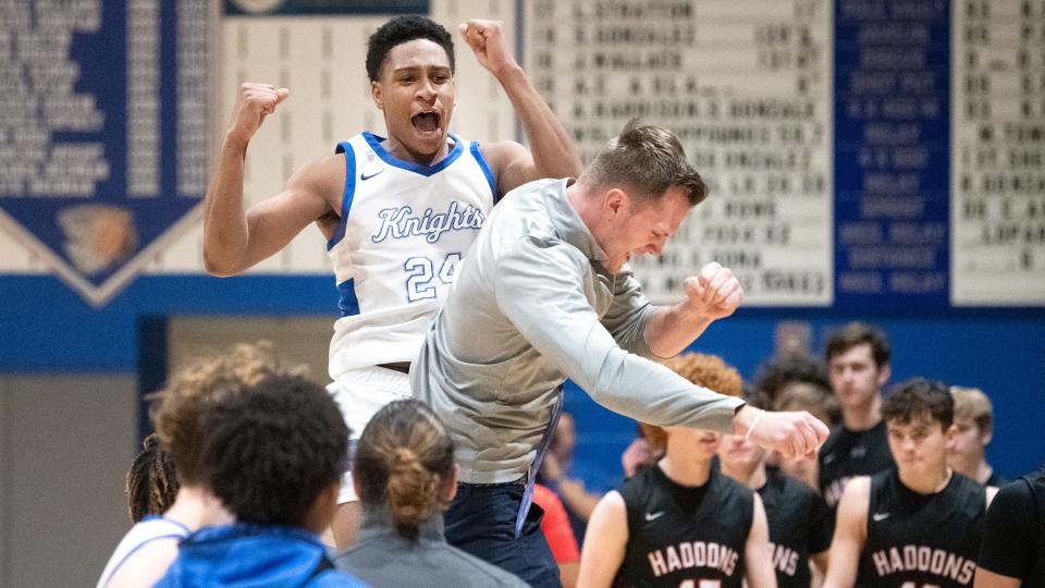 Sterling's Caleb Mundell celebrates with Sterling assistant boys basketball coach Jason Shivers after Sterling defeated Haddonfield, 47-39, in the boys basketball game played at Sterling High School on Thursday, January 5, 2023.