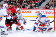 OTTAWA, CANADA - APRIL 23: Henrik Lundqvist #30 of the New York Rangers stops the puck on an attempt by Nick Foligno #71 of the Ottawa Senators in Game Six of the Eastern Conference Quarterfinals during the 2012 NHL Stanley Cup Playoffs at the Scotiabank Place on April 23, 2012 in Ottawa, Ontario, Canada. (Photo by Richard Wolowicz/Getty Images)