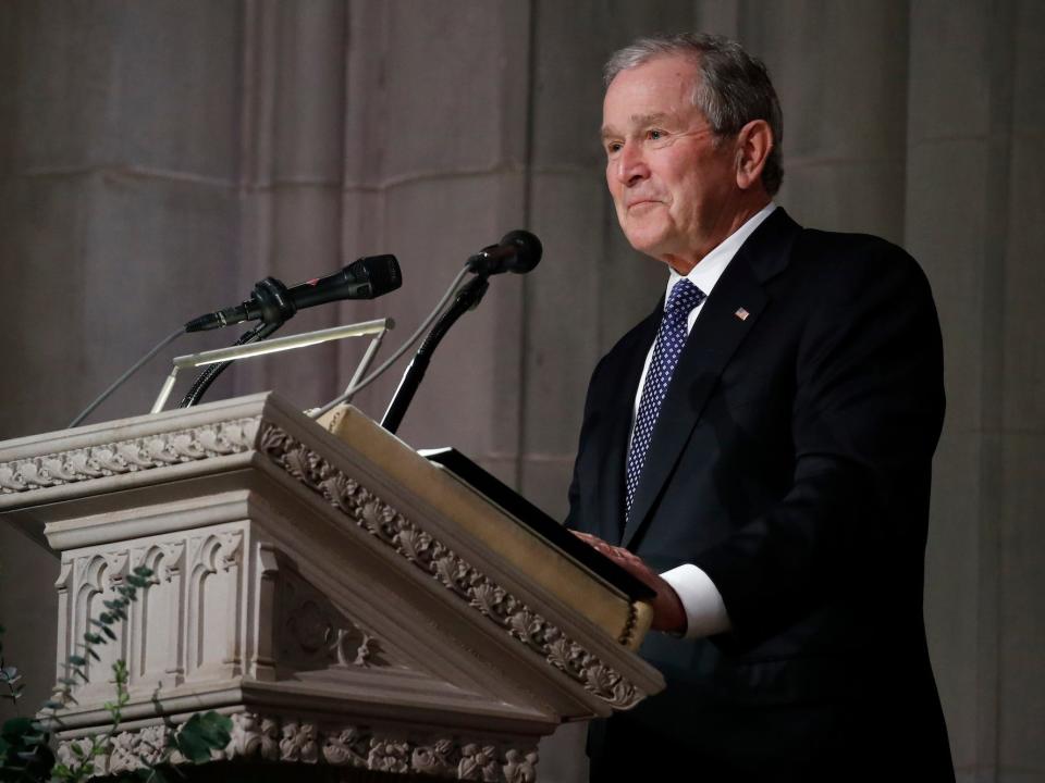 Former President George W. Bush pauses as speaks at the state funeral for his father, former President George H.W. Bush, at the Washington National Cathedral on December 5, 2018 i