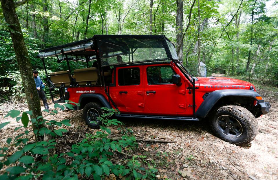 Adventure Cave Tours uses a jeep outfitted with benches to transport visitors to the cave entrance down a steep and narrow off-road path.