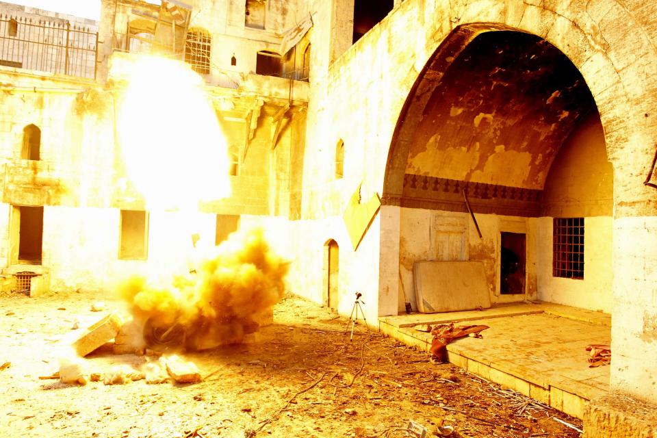 Free Syrian Army fighters fire a rocket towards forces loyal to Syria's President Bashar al-Assad in Old Aleppo