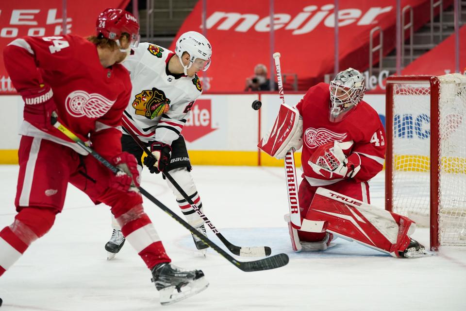 Detroit Red Wings goaltender Jonathan Bernier stops a shot by Chicago Blackhawks center Pius Suter in the third period Wednesday, Feb. 17, 2021 at Little Caesars Arena.