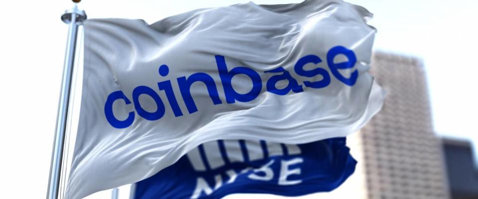 Flags of Coinbase and NYSE flying in the wind