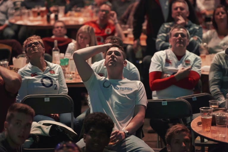 Rugby fans watch the Pool A match of the 2015 Rugby World Cup between England and Australia at Twickenham stadium, south west London on October 3, 2015