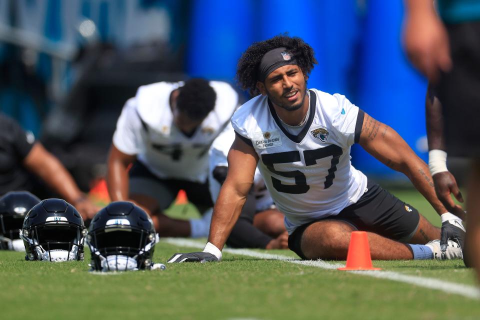 Jacksonville Jaguars linebacker Caleb Johnson (57) stretches Jacksonville Jaguars linebacker Caleb Johnson (57) stretches during an organized team activity Tuesday, May 30, 2023 at TIAA Bank Field in Jacksonville, Fla. 