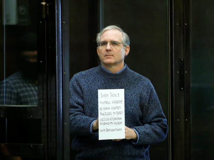 US detainee Paul Whelan holds a sign before a hearing in Moscow.