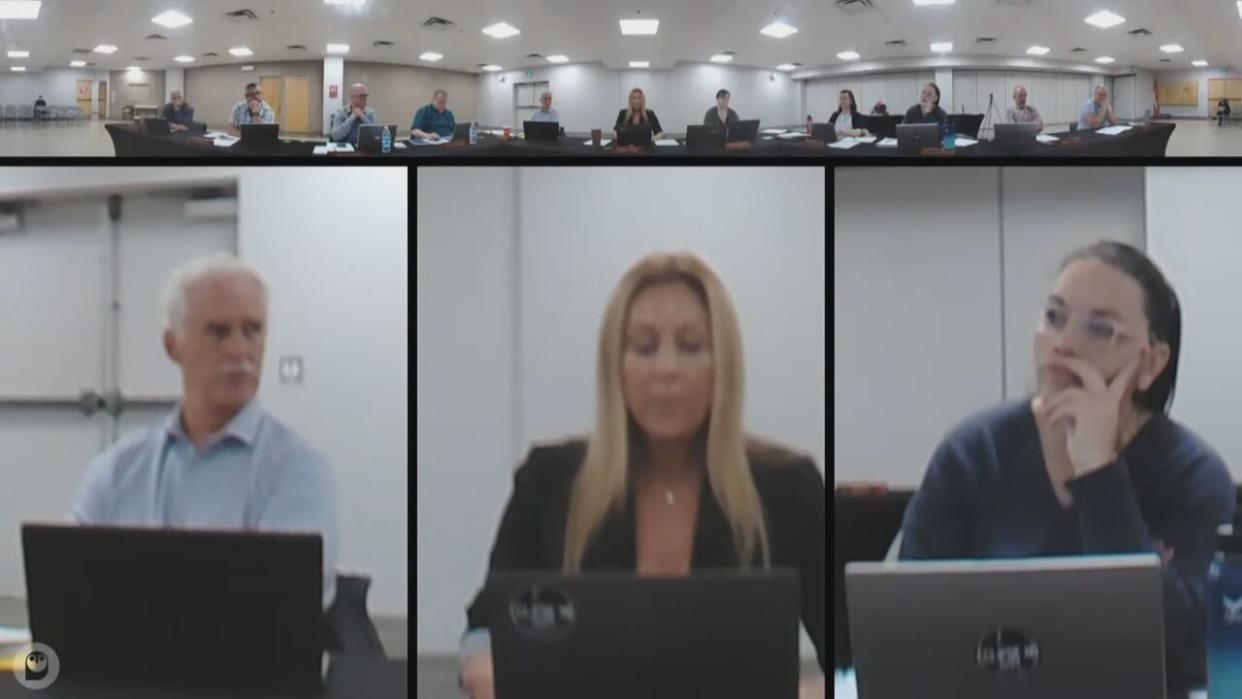 Woodstock Mayor Trina Jones, centre, addressed council Tuesday night to defend a policy on banners that no longer allows Pride flags to be flown from town lampposts. (Town of Woodstock/YouTube - image credit)