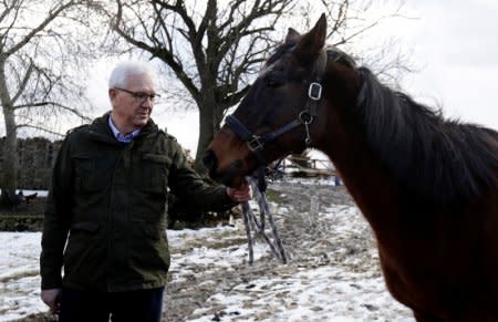 FILE PHOTO: Czech presidential candidate Jiri Drahos holds a horse during a campaign ahead of an election run-off on January 26-27, at a farm near the town of Kamenny Ujezd, Czech Republic January 19, 2018. REUTERS/David W Cerny/File Photo