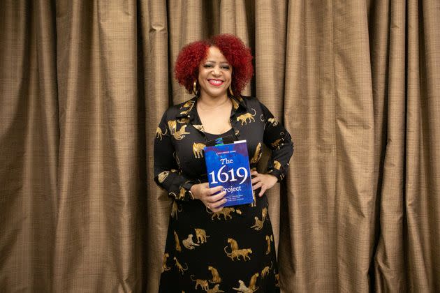 Nikole Hannah-Jones poses with her book, 