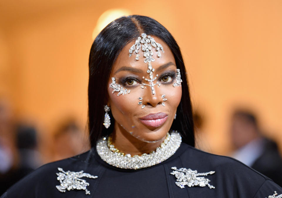 Naomi Campbell wearing face jewels