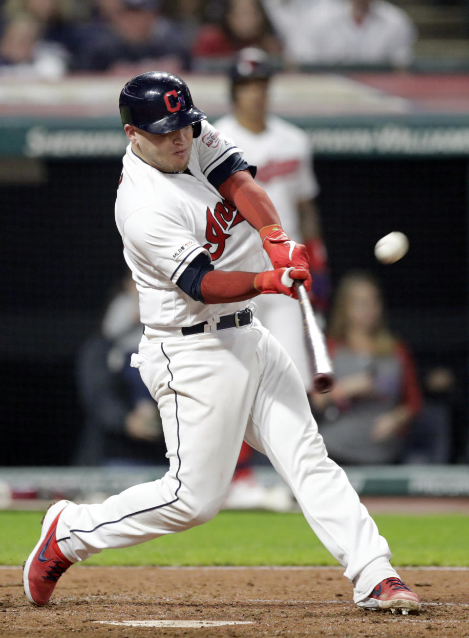 Cleveland Indians' Roberto Perez hits a sacrifice fly during the seventh inning of the team's baseball game against the Minnesota Twins, Thursday, June 6, 2019, in Cleveland. (AP Photo/Tony Dejak)