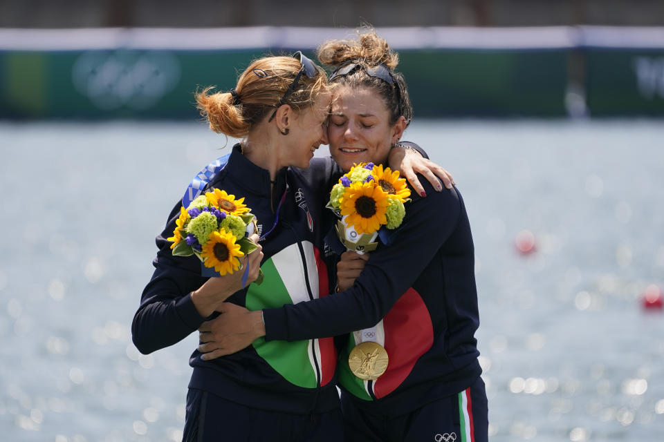 Valentina Rodini and Federica Cesarini of Italy pose with the gold medal in the lightweight women's double sculls final at the 2020 Summer Olympics, Thursday, July 29, 2021, in Tokyo, Japan. (AP Photo/Darron Cummings