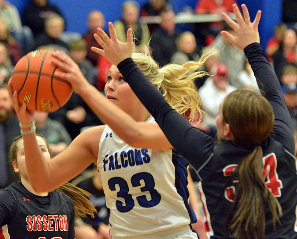 Florence-Henry's Caylin Kelly (33) eyes the basket against Sisseton's Tara Nelson during their high school girls basketball game on Thursday, Feb. 15, 2024 in Florence. Sisseton won 62-54.