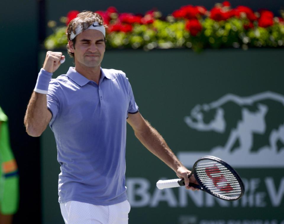 Roger Federer, of Switzerland, celebrates his win against Alexandr Dolgopolov, of Ukraine, during their semifinal match at the BNP Paribas Open tennis tournament, Saturday, March 15, 2014, in Indian Wells, Calif. (AP Photo/Mark J. Terrill)