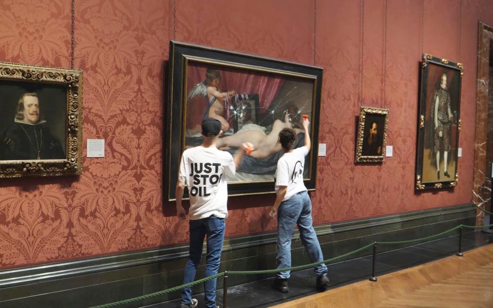 Activists hit the protective glass on a painting at the National Portrait Gallery in London in November