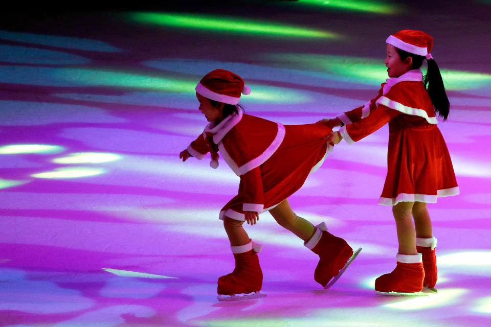 Young Chinese ice skaters perform at a Christmas event in Beijing