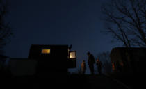 In this picture taken on Thursday, Nov. 15, 2018, fishermen prepare for the traditional fish haul of the Krcin pond near the village of Mazelov, Czech Republic. Czechs will have to pay more for their traditional Christmas delicacy this year after a serious drought devastated the carp population this year. (AP Photo/Petr David Josek)