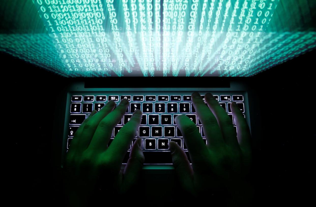 Hackers stole $14.2 million from an accounts payable account belonging to Canadian Western Bank in January. The theft has sparked a legal battle in Vancouver. (Kacper Pempel/Reuters - image credit)