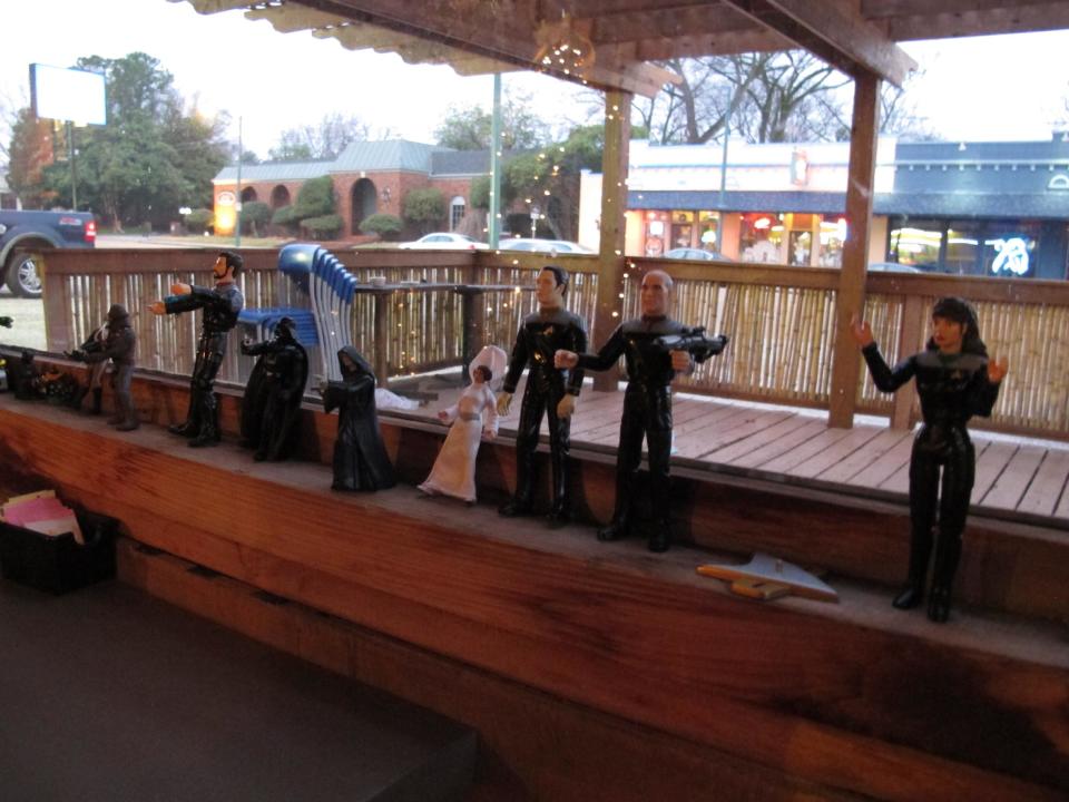 This Dec. 22, 2013 photo shows action figures and miniature dolls lining a windowsill at Crazy Noodle restaurant in Memphis, Tenn. The figures were given to the restaurant by regular customers and they can be found throughout the place, which serves Korean style soups and noodle dishes. (AP Photo/Adrian Sainz).