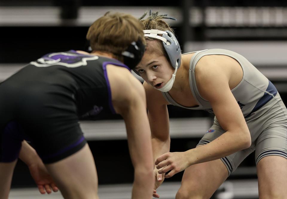 Corner Canyons’ Tanner Telford, right, competes against Riverton’s Easton Rolson in the 6A Wrestling State Championships at the UCCU Center in Orem on Friday, Feb. 16, 2024. | Laura Seitz, Deseret News