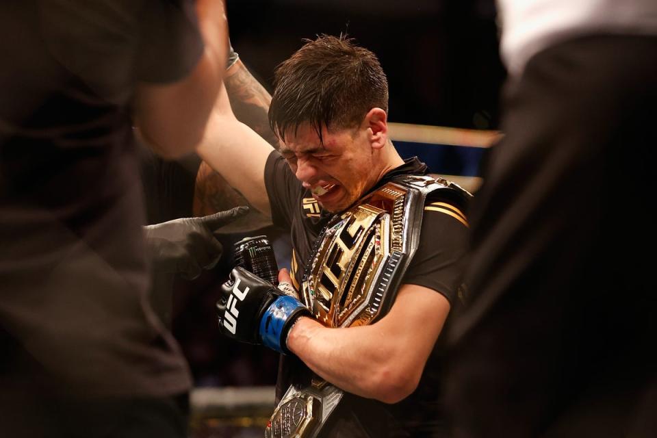 Moreno celebrating his first UFC title triumph, after submitting Figueiredo in 2021 (Getty Images)