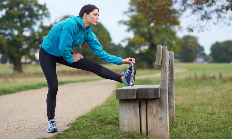 A woman runner takes a break