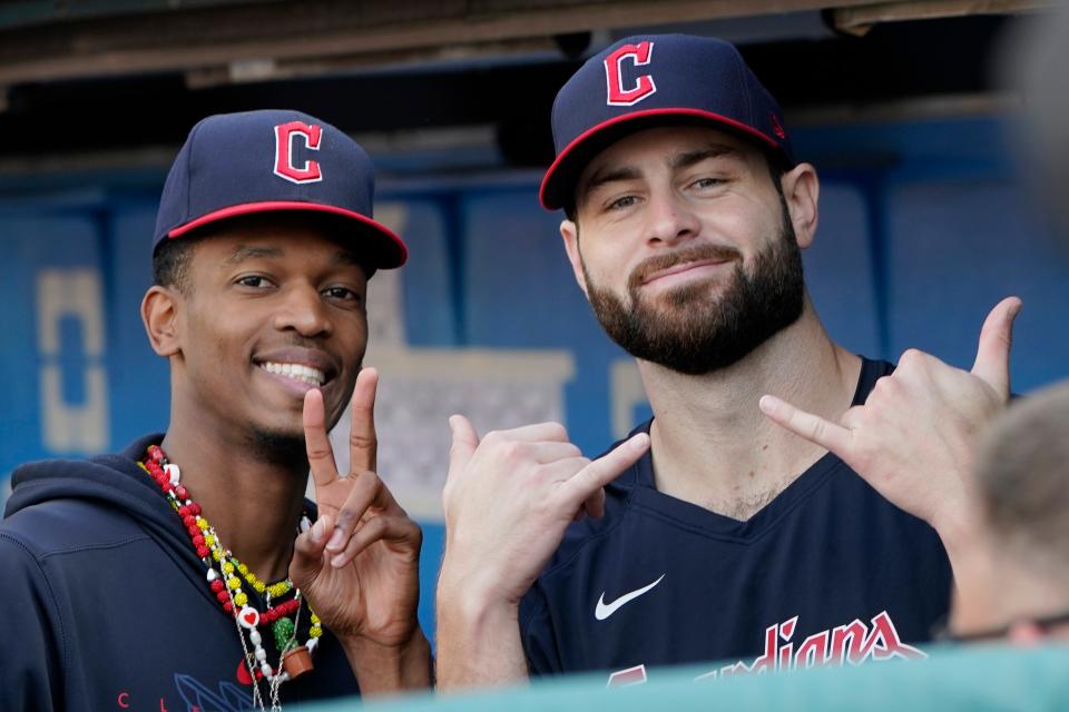 Cleveland Guardians pitchers Triston McKenzie, left, and Lucas Giolito, right, gesture from the dugout in the first inning against the Tampa Bay Rays on Sept. 3 in Cleveland.