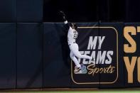 May 7, 2019; Oakland, CA, USA; Oakland Athletics center fielder Ramon Laureano (22) catches the ball and prevents a home run score by the Cincinnati Reds during the sixth inning at Oakland Coliseum. Mandatory Credit: Stan Szeto-USA TODAY Sports