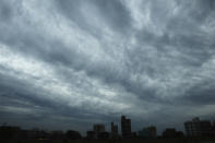 Rain clouds loom over a Kolkata on May 19, 2020. (Photo by DIBYANGSHU SARKAR/AFP via Getty Images)