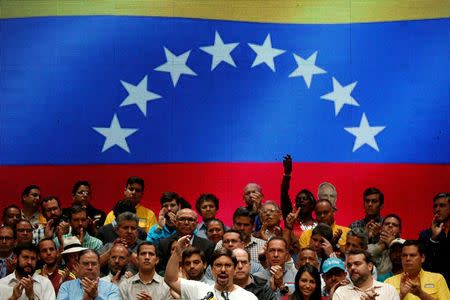 Freddy Guevara (C), first Vice-President of the National Assembly and lawmaker of the Venezuelan coalition of opposition parties (MUD), talks to the media during a news conference in Caracas, Venezuela July 17, 2017. REUTERS/Carlos Garcia Rawlins