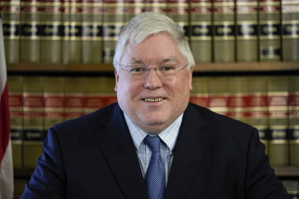 FILE - West Virginia Attorney General Patrick Morrisey speaks with reporters during a press conference at the state Capitol in Charleston on Thursday, May 4, 2023, in Charleston, W.Va. Secretary of State Mac Warner and Attorney General Patrick Morrisey say they remain concerned U.S. President Joe Biden's victory was not legitimate. That's despite repeated investigations, audits and court cases concluding there was no evidence of widespread voter fraud or improper counting that could have changed the results. (AP Photo/Jeff Dean, File)